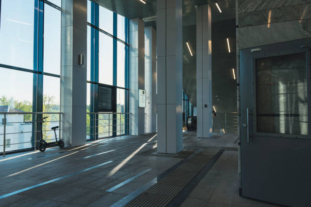istock Spacious modern train station interior with sunlight and glass walls 2190991023