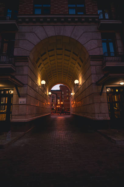istock Illuminated urban archway at dusk with streetlights 2190991034