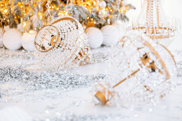 istock Decorative gift boxes and festive ornaments near a sparkling Christmas tree 2190996844