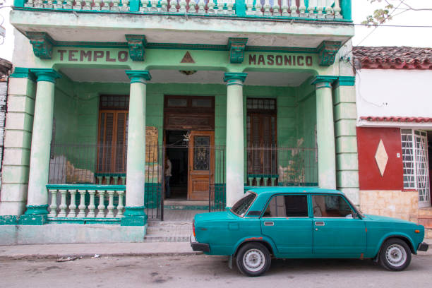 Cuba, Havana. Masonic Temple with old car in front. 2016-04-03