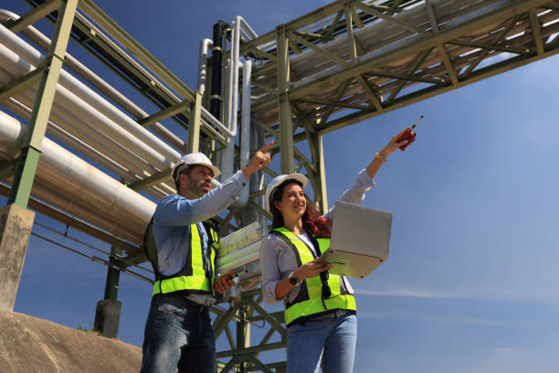 istock female and male piping system engineers working  at the pipeline construction in the refinery or chemical plant at an industrial estate 2191007616