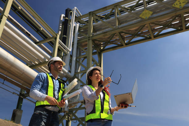 istock female and male piping system engineers working  at the pipeline construction in the refinery or chemical plant at an industrial estate 2191007617