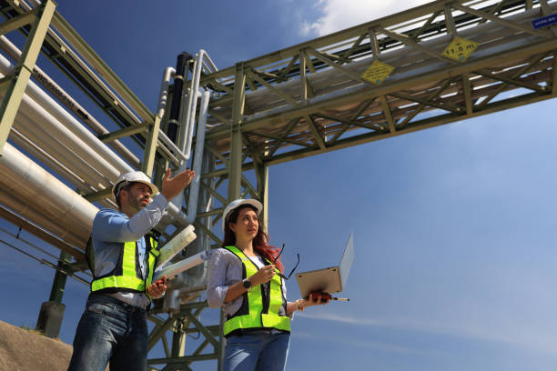 istock female and male piping system engineers working  at the pipeline construction in the refinery or chemical plant at an industrial estate 2191007620