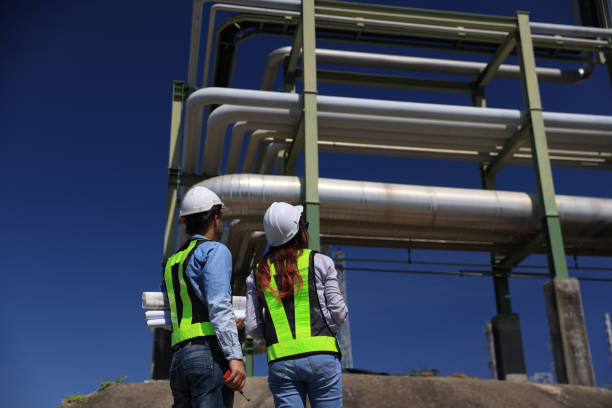 istock female and male piping system engineers working  at the pipeline construction in the refinery or chemical plant at an industrial estate 2191007625