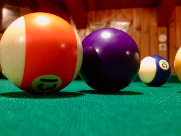 istock Colorful Billiard Balls on a Green Felt Table 2191014444