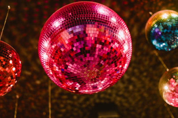 istock A pink disco ball is hanging from the ceiling 2191017299