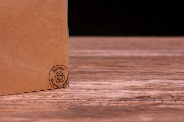 istock Brown Eco-Friendly Recycled Notebook with Recycling Logo. Minimalist brown notebook made entirely from recycled materials, featuring an embossed recycling logo on it. 2191019337