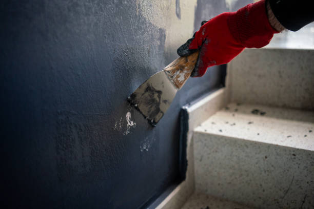 istock spatula is in male hand with red glove horizontal fixxer upper home still 2191019537