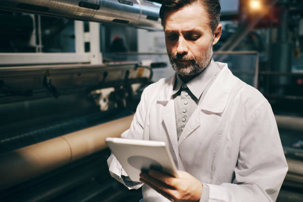 istock Engineer working at the factory with machinery and gadgets 2191020538