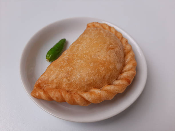 istock Pastel, is a pastry filled with chicken meat and mixed vegetable, then deep fried. Snack from Indonesia. On white plate. Isolated in white background. 2191020966