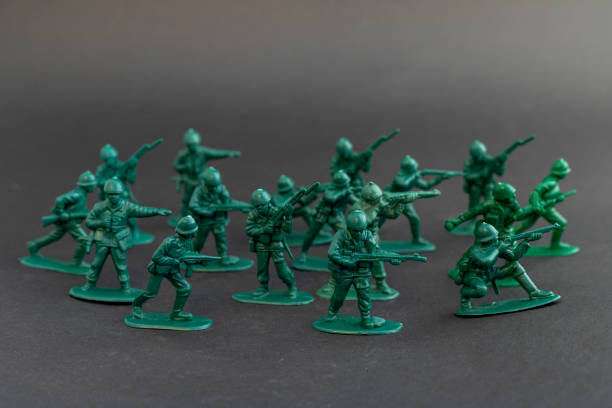 Green plastic army men in combat poses
