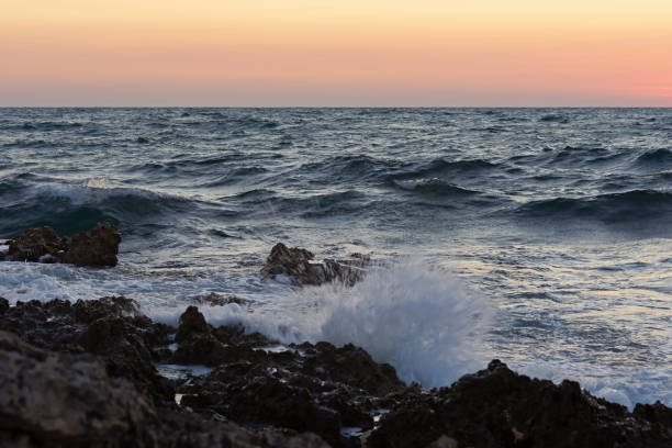 istock Sunset and storm at sea. Big waves against the setting sun. 2191021959