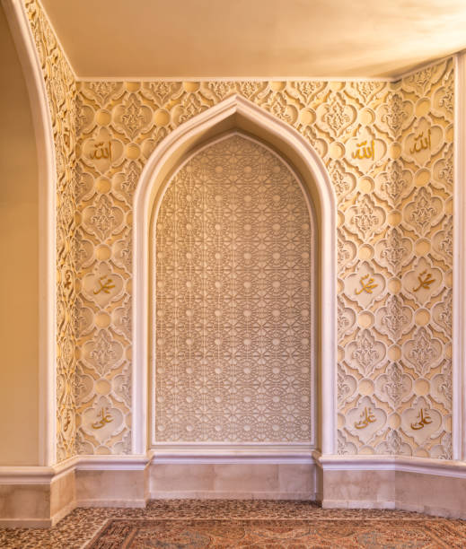 istock Intricately designed wall in a serene mosque showcasing Islamic art and calligraphy in warm tones 2191022816