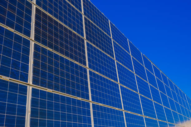 Close up of solar panel system on the roof. Blue and black photovoltaic for producing clean ecological electricity module. Black and blue contact grid of high sensitivity solar cell. Ideal for any renewable article or design.