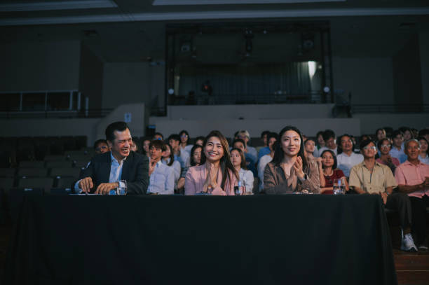 istock satisfied and happy panel judges applauding on talent show contest 2191026702