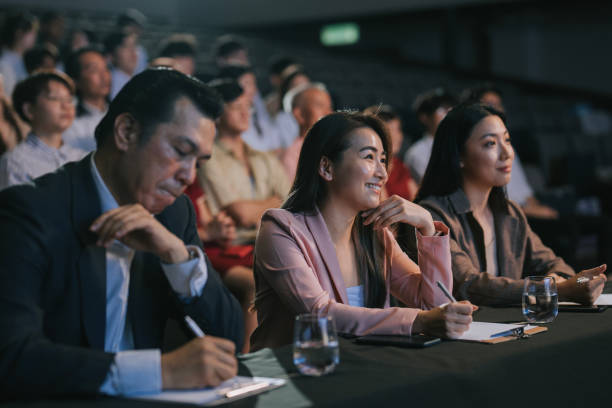 istock satisfied happy Asian panel judges giving score to stage performance competition in front of audience 2191026737