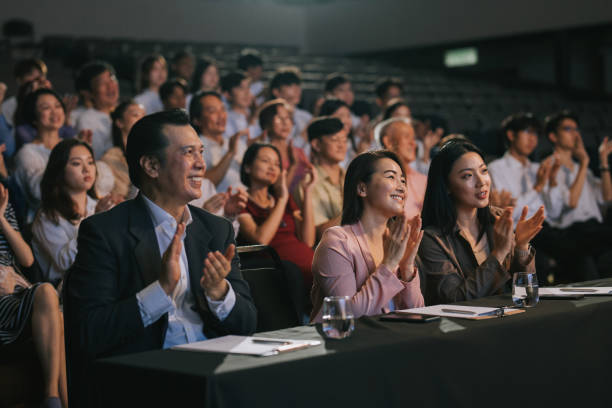 istock Asian panel judge applauding to stage performance competition in front of audience 2191026743