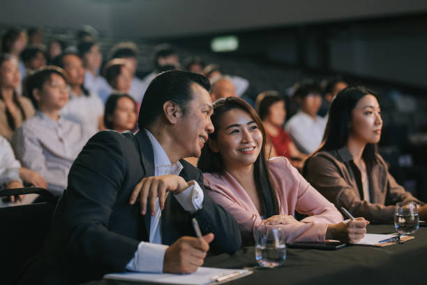 istock satisfied happy Asian panel judges giving score to stage performance competition in front of audience 2191026746