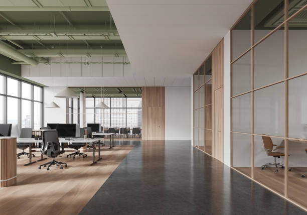 istock Modern office interior with an open space design, featuring large windows, minimalist furniture, and glass partitions. Bright and spacious atmosphere. 3D Rendering 2191028030