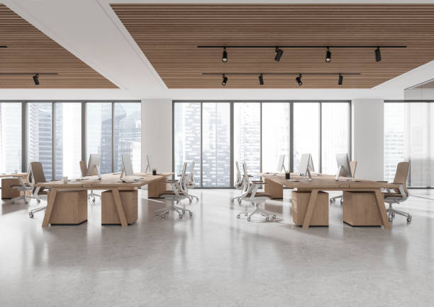 istock Spacious open space office with wooden desks and chairs, large windows showing cityscape. Modern interior, business concept. 3D Rendering 2191028290