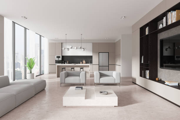 istock Modern open-plan living room and kitchen with minimalist design and neutral colors. 3D Rendering 2191028527