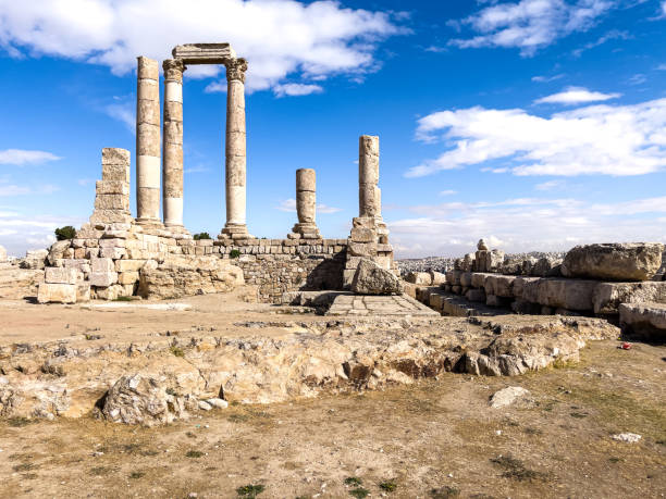 istock Historic stone columns rising against a clear blue sky, presenting an ancient architectural marvel set amidst stunning natural surroundings. 2191028802