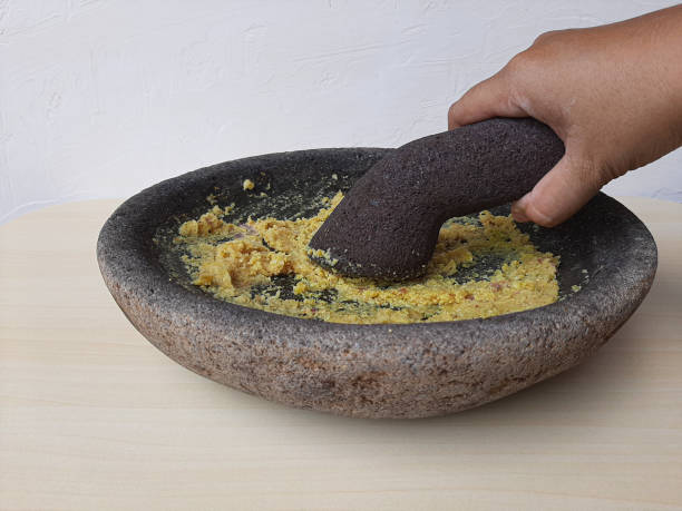 Mashed seasoning, from garlic, candlenut, salt and pepper. Handmade, traditionally made with stone mortar. Basic seasoning for various Indonesian cuisine