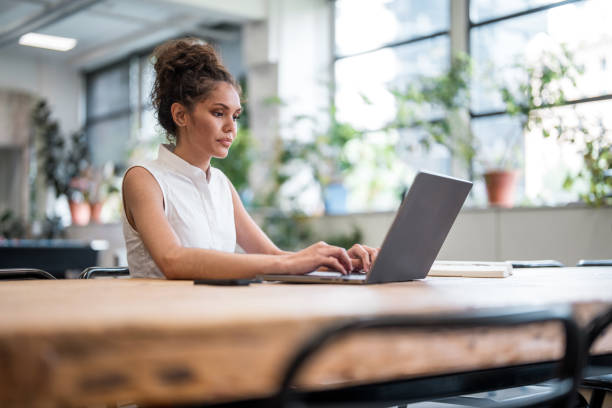 istock Confident Aboriginal Businesswoman Engaging with Laptop in Modern Office 2191033512