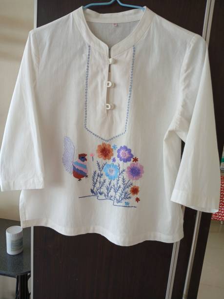 istock Cream colored long sleeved shirt with hand embroidery 2191034245