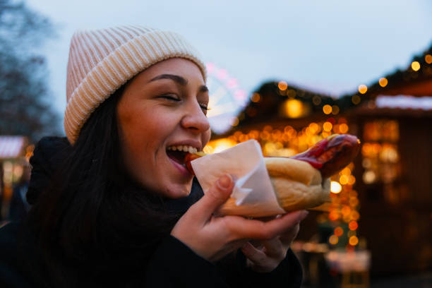 istock Savoring a Tasty Snack at Berlin's Christmas Market 2191034532