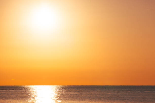 istock Golden Horizon with Sunlit Reflections on Calm Ocean Waters 2191034950