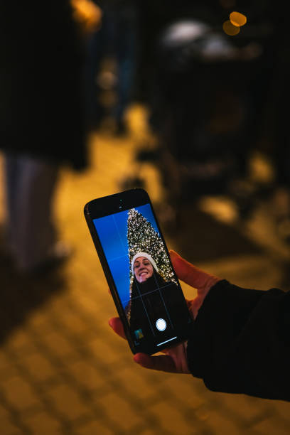 istock Joyful Selfie in Front of a Christmas Tree at Berlin's Market 2191036676