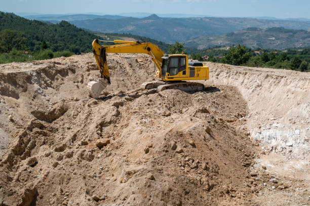 istock Excavator in the construction of a dam for water storage 2191036924