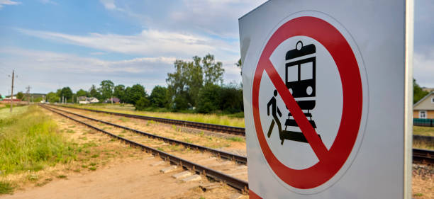 istock Warning Sign Prohibiting Access to Railway Tracks Under the Bright Sunlight 2191039920