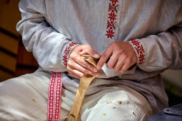 istock A Craftsman's Delicate Touch: Shaping a Wooden Spoon in a Rustic Workshop 2191040940