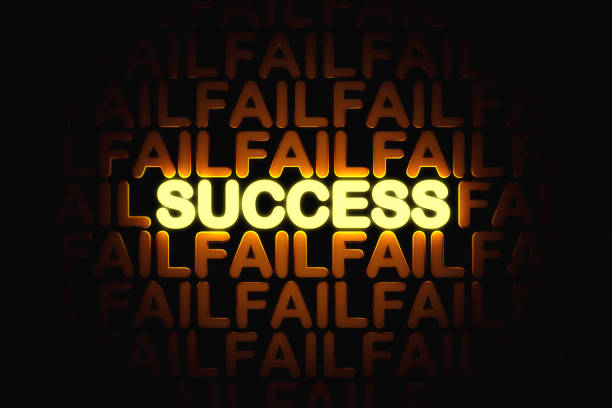 word SUCCESS with bright golden neon light among FAIL word on black background. concept of learning from failure or wrong ideas to succeed in work and business.