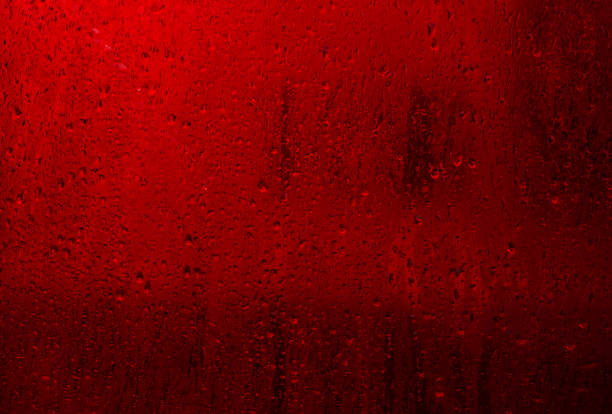 wet red glass. condensation on the glass