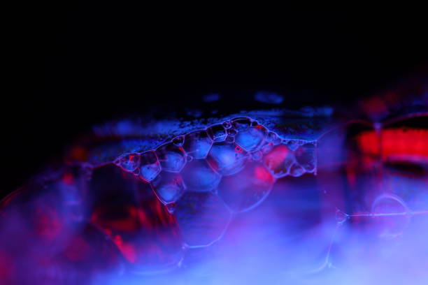 istock Purple liquid texture in macro, bright fluid, bubbles in macro, dark background, copy space 2191041963