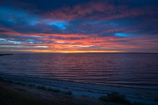 A wide angle shot of the sun rising over Kangaroo Island at dawn