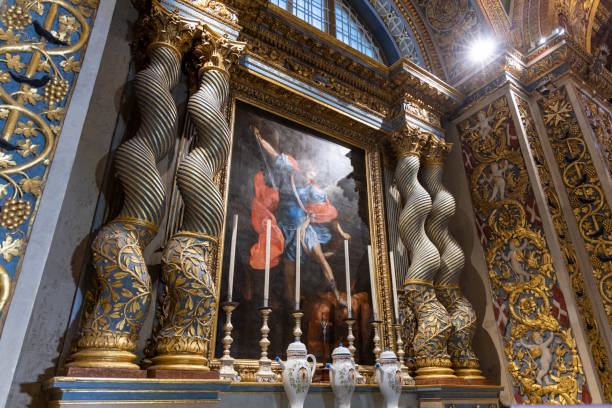 The ornate interior of St. John's Co-Cathedral in Valletta, Malta, featuring intricate baroque design and rich artwork.