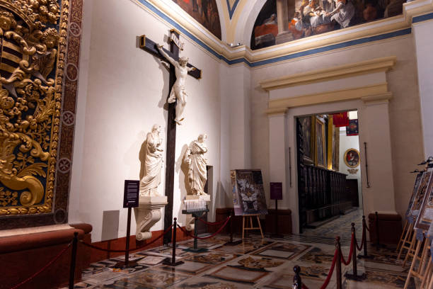 The ornate interior of St. John's Co-Cathedral in Valletta, Malta, featuring intricate baroque design and rich artwork.