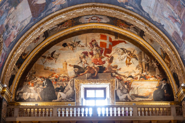 The ornate interior of St. John's Co-Cathedral in Valletta, Malta, featuring intricate baroque design and rich artwork.