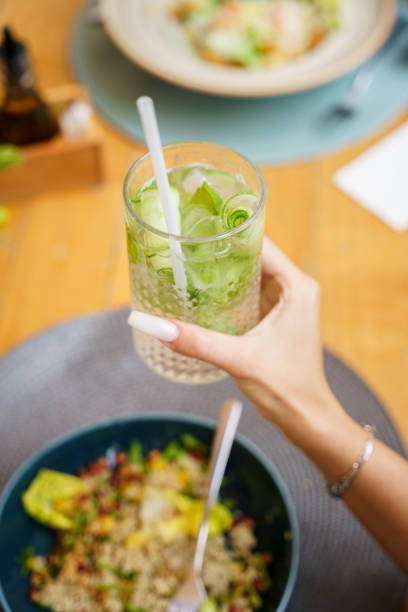 istock Refreshing cucumber and mint beverage in hand 2191046102