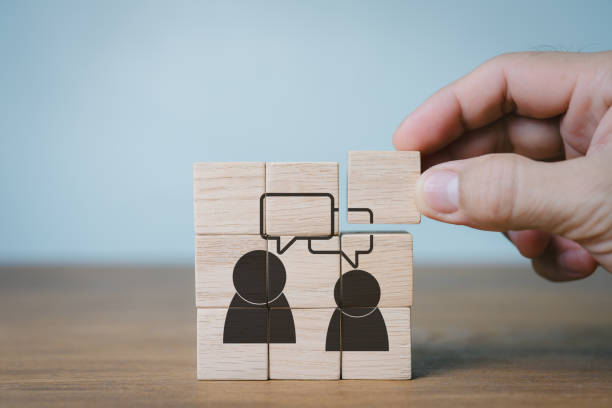 istock Concept of consumer feedback. Assessing customer satisfaction helps create and enhance products and services. client-focused. Wooden cubes are manually placed with feedback icon  with copy space. 2191047044