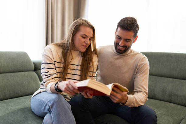 istock Happy couple relaxing at home 2191050321
