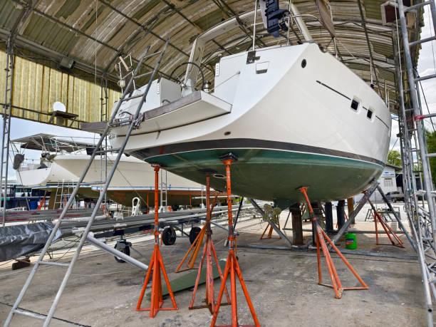 istock A boat is carefully lifted under a covered structure 2191050622