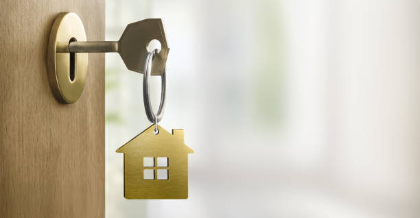 istock Half opened door into the new home interior 2191051744