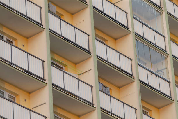 istock Residential Building Balconies Featuring Bright Yellow Background Design 2191054012