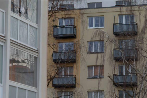 istock An Apartment Building featuring Balconies alongside Nearby Structures in a City 2191054685