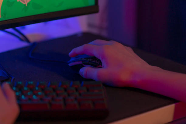 istock A person uses a mouse and keyboard to play a video game 2191054818